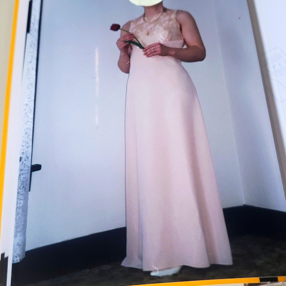 Peach color very feminine dress size 8.